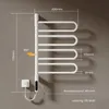 A white electric towel rack mounted on a gray wall, with dimensions and specifications overlaid as text. Produktbild-Vorschau