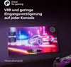 A gaming setup with a TV displaying a racing game, a game controller in the foreground, and marketing text overlaying the top of the image. Náhled obrázku produktu