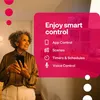An older woman is holding a smartphone and looking up and to the right, with a pink overlay on the right side of the image listing smart control features. Produktbild-Vorschau