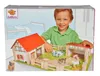 A child playing with a toy farm set on a box. Anteprima dell’immagine prodotto
