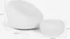 A white bouclé armchair and matching ottoman are shown against a white background with dimensions indicated by lines and text. Produktbild-Vorschau