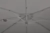 The underside of a large umbrella frame, showing the metal structure and fabric. Produktbild-Vorschau