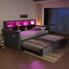 A bedroom scene at night with a daybed pulled out and illuminated by pink LED lights. Voir les images du produit