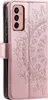 A rose gold flip phone case with a mandala pattern embossed on the cover. Produktbild-Vorschau