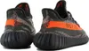 A pair of Adidas Yeezy Boost 350 V2 sneakers shown from a rear-side angle against a white background. Produktbild-Vorschau