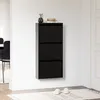 A black shoe cabinet mounted on a white wall in a hallway. Náhľad obrázku produktu