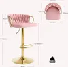 A pink bar stool with gold accents is shown with various measurements indicated by lines and text. Produktbild-Vorschau