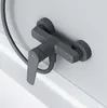 A close-up view of a modern gray shower faucet mounted on a white wall. Produktbild-Vorschau