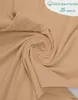 A close-up view of beige fabric, swirled into a spiral. Produktbild-Vorschau