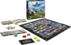 A board game with its box and accessories laid out on a white surface. Náhled obrázku produktu