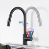 A black kitchen faucet shown in a studio setting against a white and light gray background. Produktbild-Vorschau