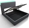 A grey upholstered bed frame with the storage lift mechanism open, revealing the slatted base and storage compartment underneath. Subtle green LED lighting is visible at the top of the headboard. Anteprima dell’immagine prodotto