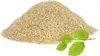 A pile of wood shavings with a branch of green leaves in the foreground. Podgląd zdjęcia produktu