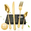 A set of golden cutlery is displayed in front of a black box with a honeycomb pattern. Produktbild-Vorschau