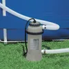 A pool heater connected to an inflatable pool, sitting on grass. Anteprima dell’immagine prodotto
