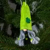 A St. Patrick's Day gnome ornament hangs on a Christmas tree. Produktbild-Vorschau
