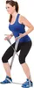 A woman is performing a fitness exercise using a resistance band. Produktbild-Vorschau