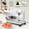 A close-up of a silver electric slicer with a pile of sliced ham in the foreground. Produktbild-Vorschau