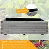 A wooden planter box with a black liner, set against a blurred background of green plants. An orange arrow points to a close-up of the planter's construction, indicating it includes a plant liner. Produktbild-Vorschau