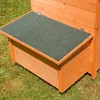 Close-up of a wooden chicken coop with a green roof, placed on grass. Podgląd zdjęcia produktu