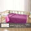 A child's bed with a purple blanket and a pink underblanket, a pillow, and a teddy bear. Produktbild-Vorschau