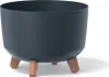 A dark gray planter with three wooden legs is shown against a white background. Náhled obrázku produktu