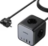 A black cube-shaped power strip with USB and USB-C ports and AC outlets, connected to a black power cord with a European plug. Produktbild-Vorschau