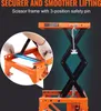 A close-up view of an orange scissor lift motorcycle jack with a detailed inset showing a safety pin mechanism. Produktbild-Vorschau