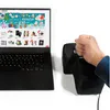 A laptop is open, displaying a website with various products. Next to it, a hand is holding a large black object with an 'E' and an arrow on it. Podgląd zdjęcia produktu