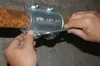 A person's hands are shown tightening a clamp on a copper pipe with a tool. Náhľad obrázku produktu