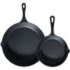 Two black cast iron frying pans of different sizes are shown against a white background. Produktbild-Vorschau