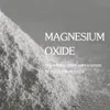 A pile of white powder, likely magnesium oxide, with text overlay. Náhled obrázku produktu