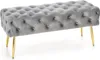 A tufted upholstered bench with gold legs on a white background. Produktbild-Vorschau
