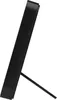 A black digital clock is shown from the side, standing on its own support. Náhled obrázku produktu