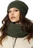 A woman wearing a green beanie and scarf. Produktbild-Vorschau
