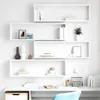 A set of white cube shelves mounted on a white wall above a white desk. Náhled obrázku produktu