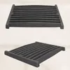 Two views of a black cast iron grate, likely for a fireplace or stove, against a neutral background. Produktbild-Vorschau