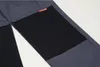 A close-up view of a pair of work pants, showing a reinforced knee area. Produktbild-Vorschau