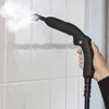 A hand holding a black steam cleaner gun, spraying steam onto a tiled wall. Podgląd zdjęcia produktu