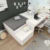 A bedroom setting with a bed and desk. Produktbild-Vorschau