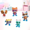 A group of five SuperKitties action figures are displayed on a white surface in front of a blurred background of a child's room. Náhled obrázku produktu