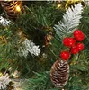 A close-up view of a decorated artificial Christmas tree, showing pinecones, red berries, and frosted branches. Produktbild-Vorschau