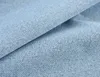 A close-up view of light blue fabric with a herringbone pattern. Produktbild-Vorschau