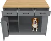 A dog is sitting inside a gray kitchen island with drawers and open storage compartments. Anteprima dell’immagine prodotto