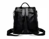 A black backpack is shown from the back against a white background. Náhľad obrázku produktu