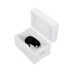 A black and white cat is lying inside a white styrofoam cat house. Náhled obrázku produktu