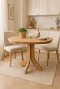 A dining table with chairs in a kitchen setting. Produktbild-Vorschau