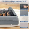 A Rottweiler puppy is sleeping on a gray dog bed, with close-up images and text highlighting the features of the bed. Produktbild-Vorschau