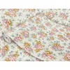 A roll of floral patterned wallpaper is shown. Produktbild-Vorschau