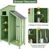 A green wooden garden shed with shelves and storage for tools. Náhled obrázku produktu